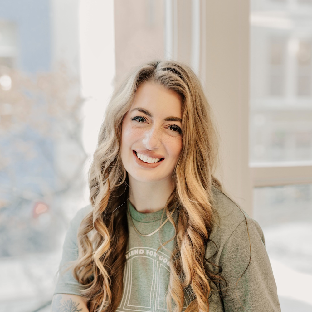 Headshot of Bethany Paquette, a white woman in her twenties with long wavy blond hair